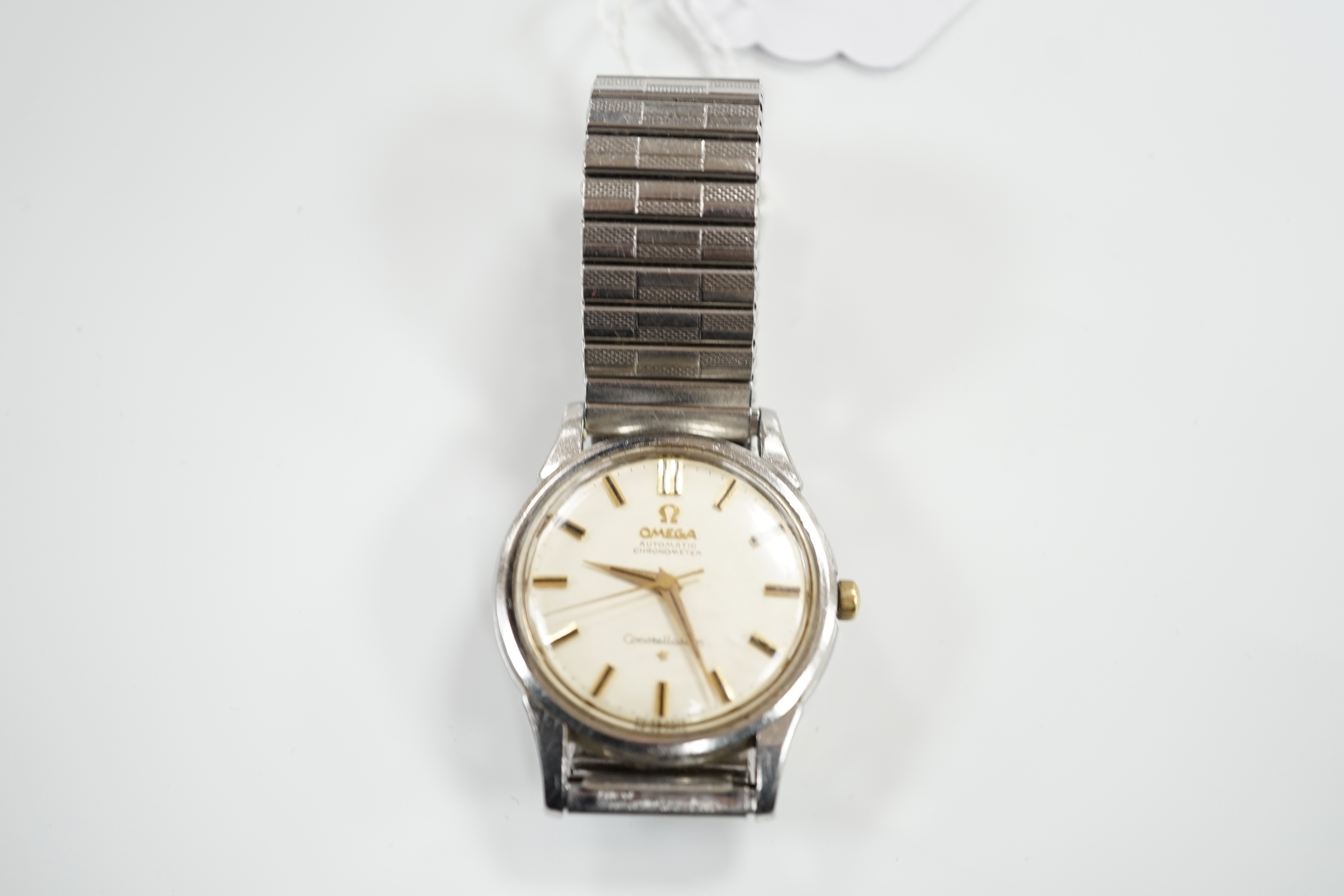 A gentleman's early 1960's stainless steel Omega Constellation Automatic Chronometer wrist watch, on an associated flexible bracelet, case diameter 35mm, movement c.551